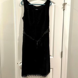 Black lace cocktail dress. Sleeveless with opening on back.